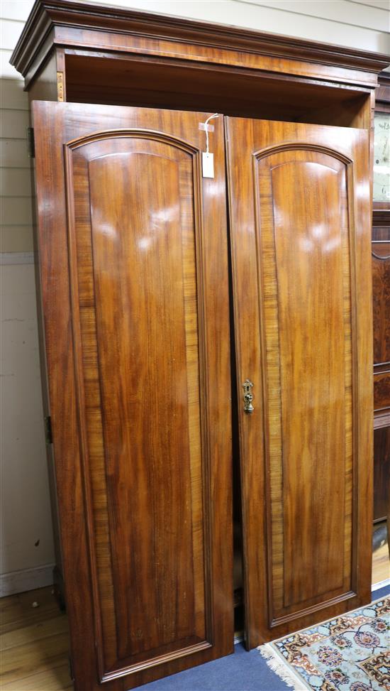 A mahogany two-door wardrobe, W.113cm